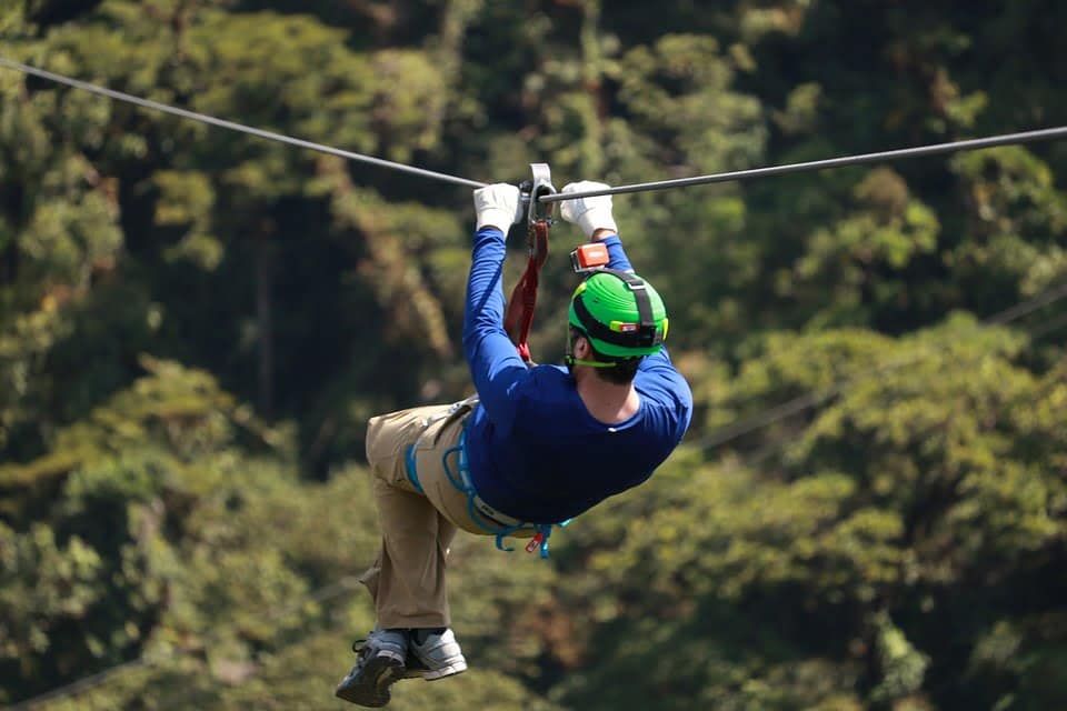 A rider on a zipline through the forest canopy near Rock Hill, South Carolina