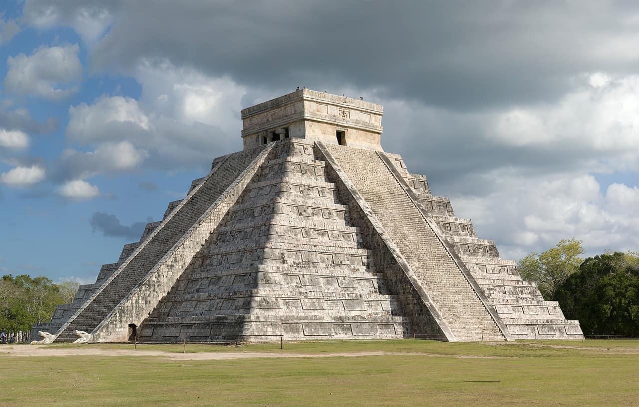 El Castillo pyramid at Chichen Itza under a blue sky