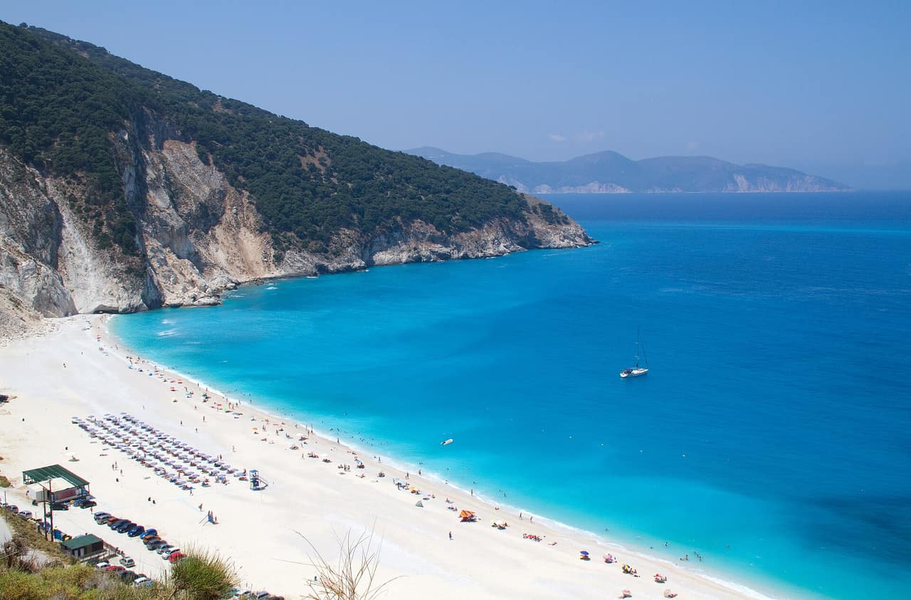 Turquoise water meeting the white pebble shore of Myrtos Beach in Kefalonia