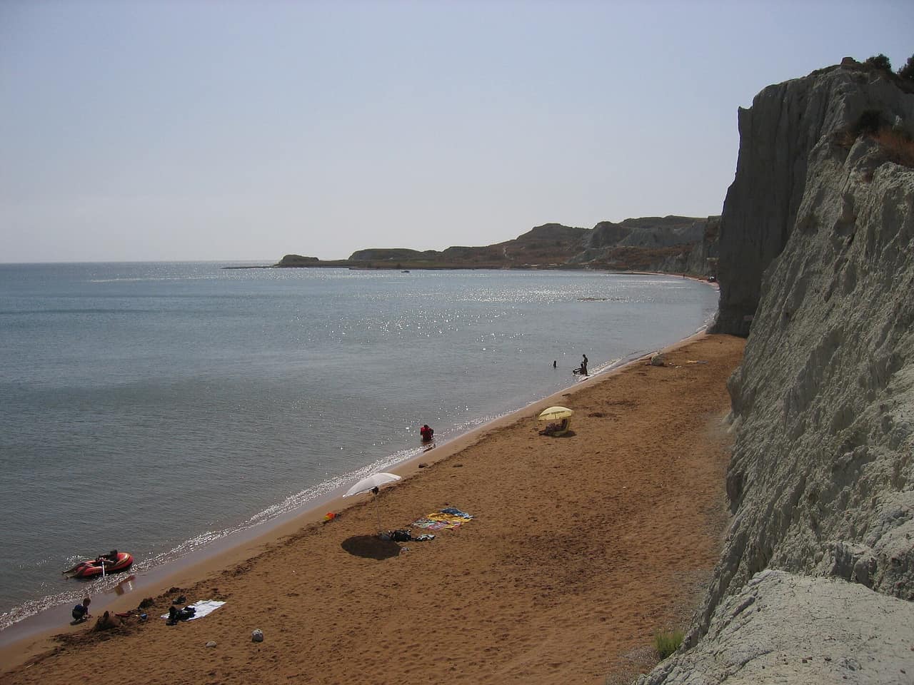 Reddish sand and shallow water at Xi Beach on the Paliki peninsula, Kefalonia